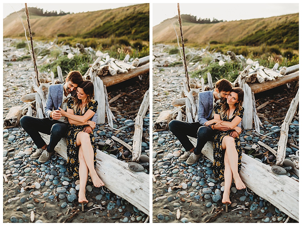 couple snuggles on beach at Whidbey Island