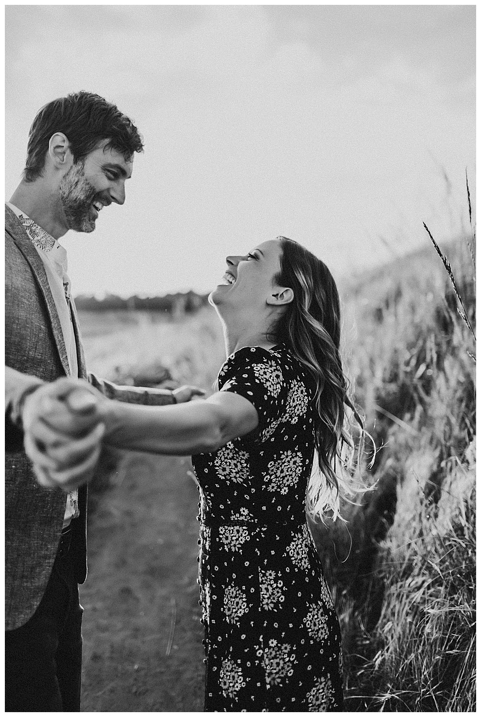 couple laughing during outdoor engagement adventure photos
