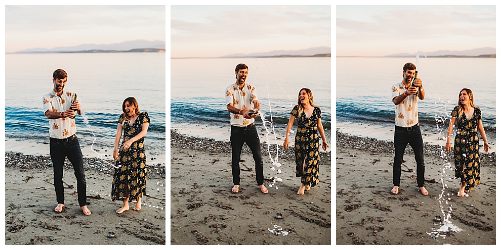 couple popping bottle of champagne on beach