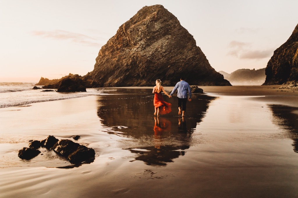 sunset engagement photos on Arch Cape beach Oregon