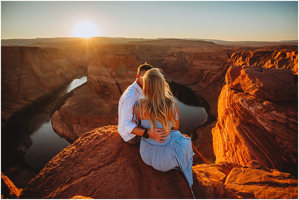 couple by a cliff at sunset