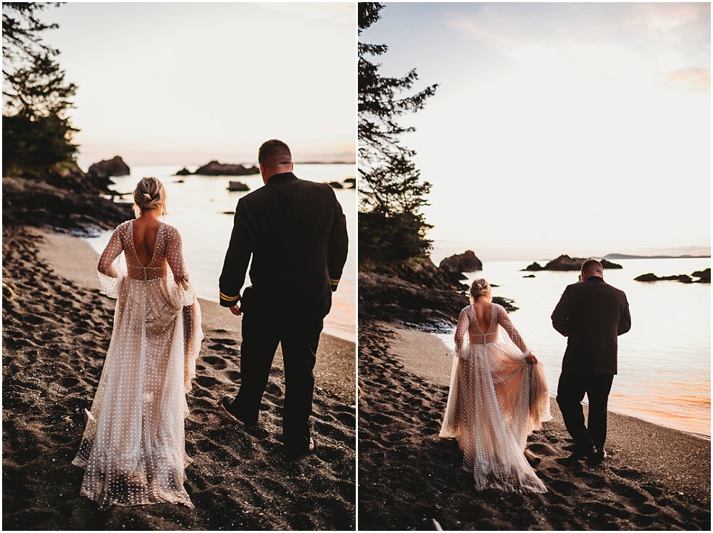 Bride and groom walk on the beach at dusk
